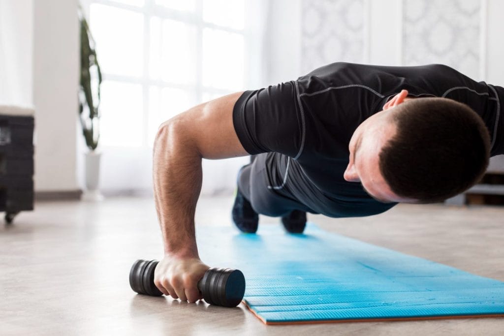 man doing push ups - At Home Chest Shoulder Triceps Workout