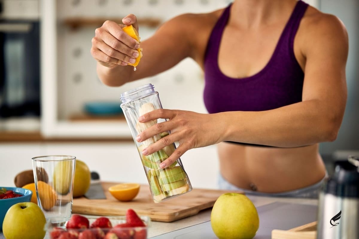 woman in kitchen - how to make pre workout at home