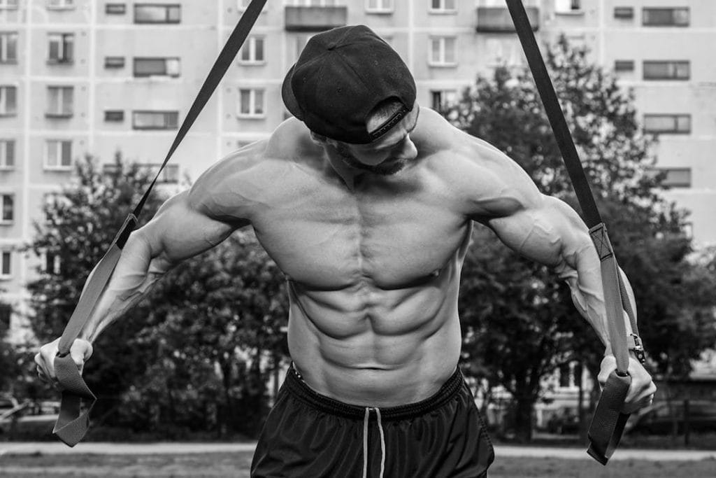 man working out - Calisthenics Beginner Workout Plan at Home