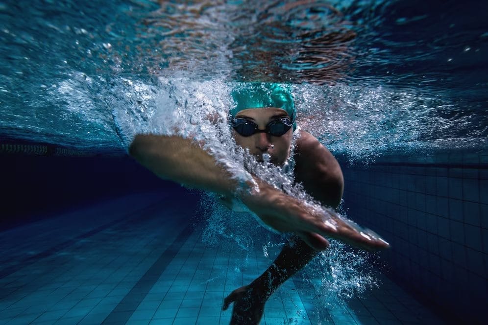 man in a pool - at home swimming workouts