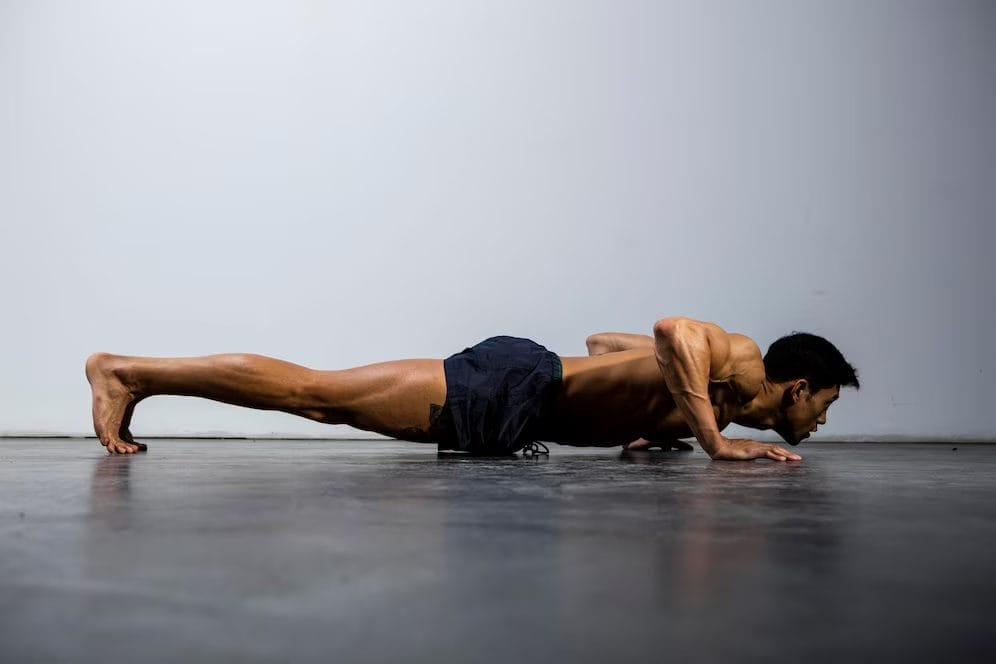 man doing pushups - at home wrestling workouts 