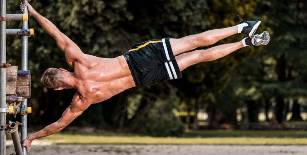 man at park - Calisthenics Beginner Workout Plan at Home