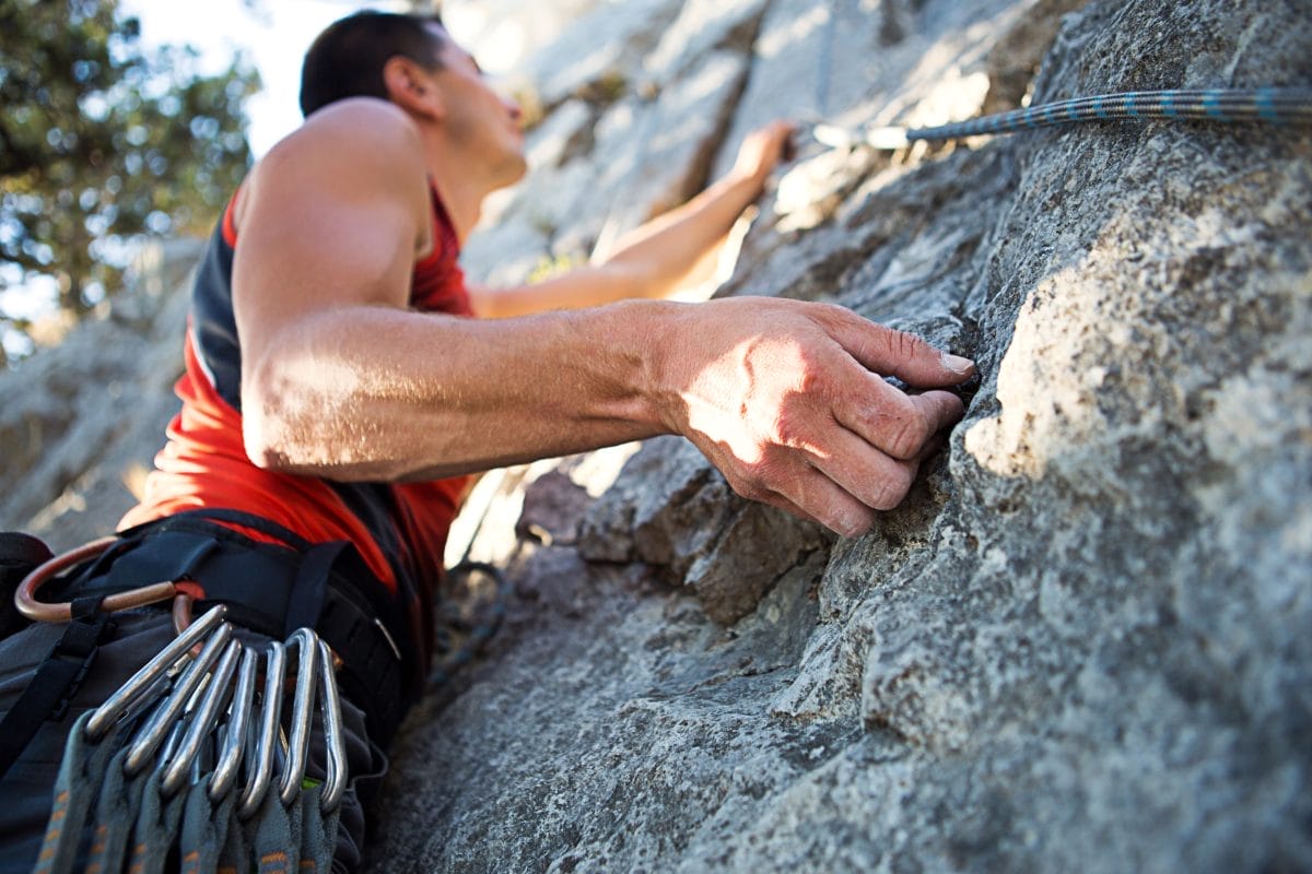 man rock climbing - at home climbing workout