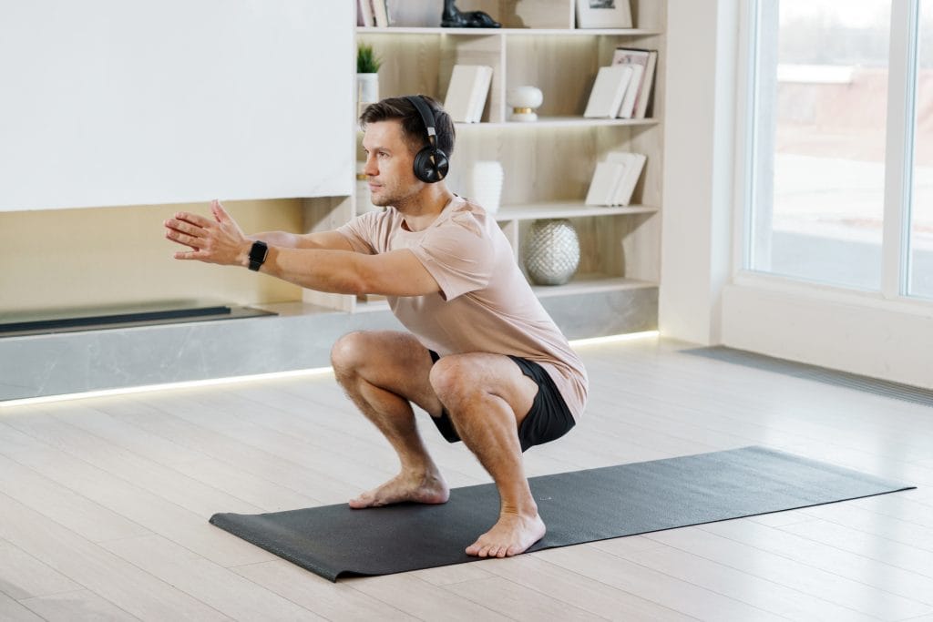 man working out - Can You Squat After a Knee Replacement